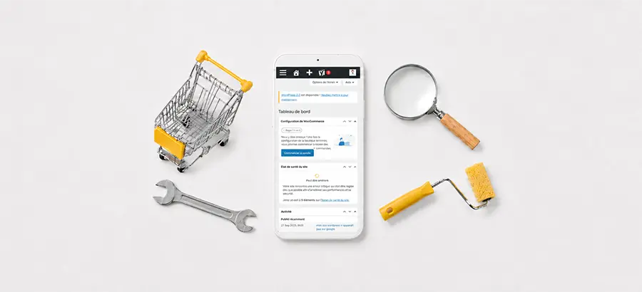 Smartphone affichant WordPress entouré d'un caddie, d'une clé, d'une loupe et d'un rouleau