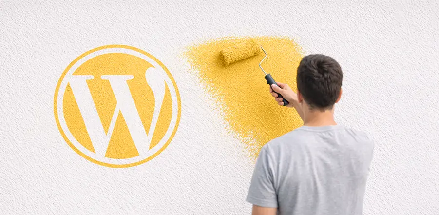 Logo WordPress peint, symbole de la personnalisation de thème pour un site vitrine pas cher.